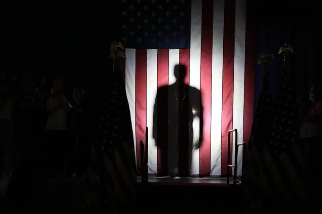 Republican presidential candidate former President Donald Trump, seen in silhouette, arrives to speak at a campaign rally on Wednesday, May 1, 2024, at the Waukesha County Expo Center in Waukesha, Wis. (Photo by Morry Gash/AP Photo)