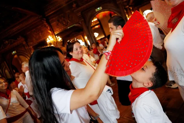 People enjoy themselves at the “Baile de la Alpargata” (The Espadrille Dance) during the San Fermin festival in Pamplona, Spain, July 9, 2019. (Photo by Susana Vera/Reuters)