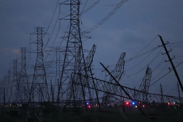 Transmission power lines are down near the Grand Parkway and West Road after a storm Thursday, May 16, 2024, in Cypress, Texas. (Photo by Melissa Phillip/Houston Chronicle via AP Photo)