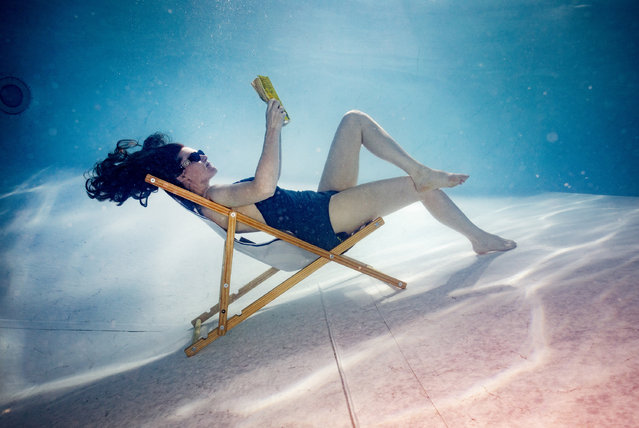 Nicola Young Jackson, 36, from Sheffield stays cool by reclining underwater in a swimming pool on June 24, 2024, as the UK enjoys some sunnier weather. (Photo by Lucy Ray/The Times)