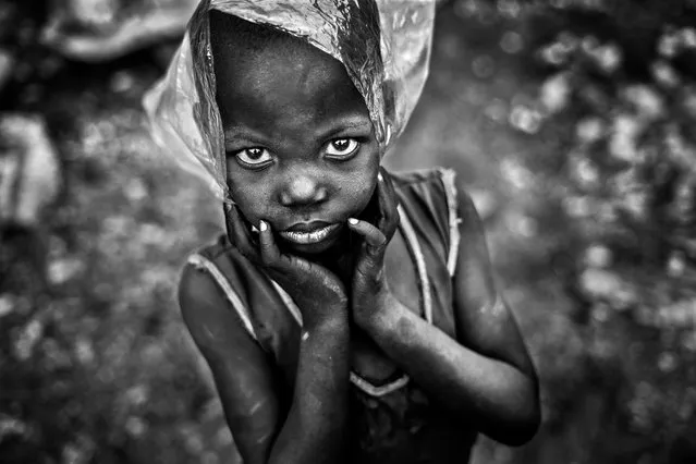 The Plastic Quarry by Aragon Renuncio, Ouagadougou, Burkina Faso. A boy plays with a plastic bag. About 380m tonnes of plastic is produced worldwide each year. Production increased exponentially from 2.3m tonnes in 1950 to 448m tonnes by 2015. Every day approximately 8m pieces of plastic pollution find their way into our oceans. (Photo by Aragon Renuncio/CIWEM Environmental Photographer of the Year 2019)
