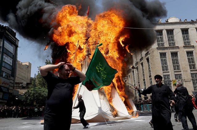 Iranian Shi'ite Muslims attend a ceremony to mark Ashura, the holiest day on the Shi'ite Muslim calendar, in Tehran, Iran on July 16, 2024. (Photo by Majid Asgaripour/WANA (West Asia News Agency) via Reuters)