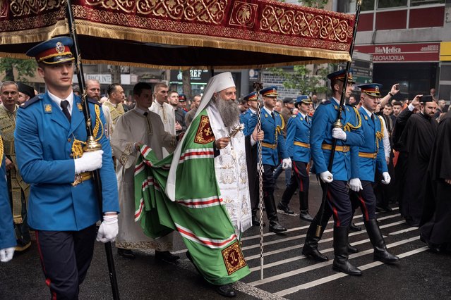 Porfirije, the patriarch of the Serbian Orthodox Church leads religious procession Spasovdanska litija in Belgrade, Serbia, May 25, 2023. Porfirije conducted the service near the Vladislav Ribnikar school, where a teenage boy killed 9 students and a security guard on May 3. Thousands turned out in the procession for the Feast of the Ascension, in which the remains of Serbian Orthodox Bishop Nikolai, who was canonised as a saint in 2003, were also carried in a covered coffin. (Photo by Marko Djurica/Reuters)