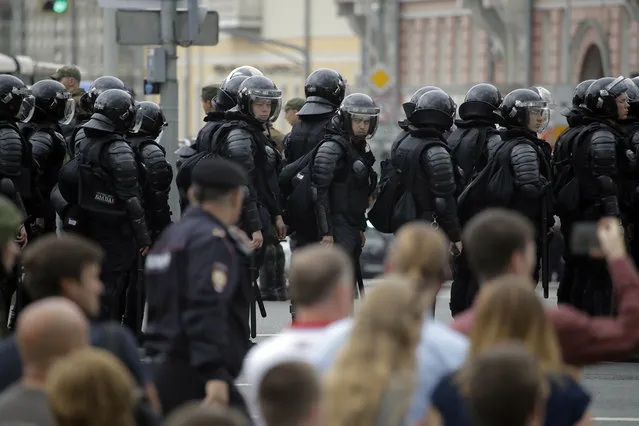 Police line up during a demonstration in downtown Moscow, Russia, Monday, June 12, 2017. (Photo by Pavel Golovkin/AP Photo)