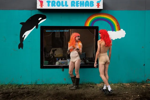 Harry Clayton-Wright and James Barnett as Trolls in front of the Troll Rehab centre, Shangri-La field, Glastonbury, 2016. (Photo by Barry Lewis/The Guardian)
