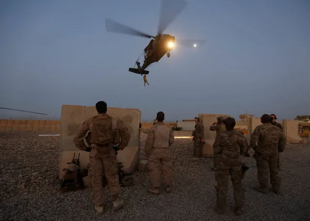 U.S. troops take part in a helicopter Medevac exercise in Helmand province, Afghanistan, July 6, 2017. (Photo by Omar Sobhani/Reuters)