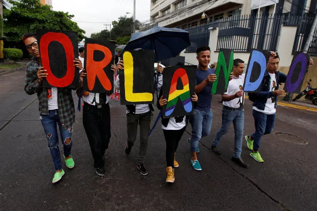 Members of the LGBT community march toward the U.S. Embassy during a vigil in memory of the victims of the Orlando Pulse gay nightclub shooting, in Tegucigalpa, Honduras, June 16, 2016. (Photo by Jorge Cabrera/Reuters)