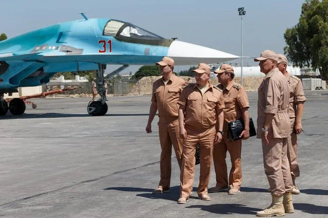 Russian Defense Minister Sergei Shoigu, second left, visits the Hemeimeem air base in Syria, Saturday, June 18, 2016. Russia's defense minister visited Syria on Saturday to meet the country's leader and inspect the Russian air base there, a high-profile trip intended to underline Moscow's role in the region. (Photo by Vadim Savitsky/Russian Defense Ministry Press Service pool photo via AP Photo)