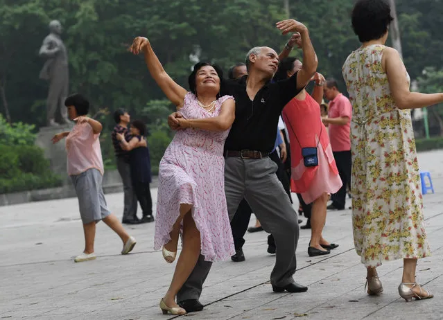 This picture taken on May 4, 2017 shows members of a dance club, mostly with retired people, dancing at Lenin park in downtown Hanoi. (Photo by Hoang Dinh Nam/AFP Photo)
