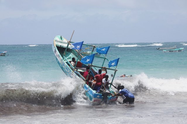 Revellers ride a boat during high waves in the Indian Ocean waters at the Liido beach in Mogadishu, Somalia on September 13, 2024. (Photo by Feisal Omar/Reuters)