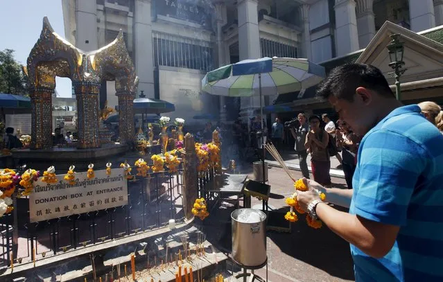 A man prays at the Erawan Shrine, the site of Monday's deadly blast, in central Bangkok August 19, 2015. (Photo by Kerek Wongsa/Reuters)