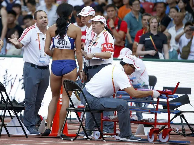 Katarina Johnson-Thompson of Britain talks to judges as she competes in the long jump event of the women's heptathlon during the 15th IAAF World Championships at the National Stadium in Beijing, China, August 23, 2015. (Photo by Phil Noble/Reuters)
