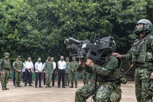 In this photo released by the Taiwan Ministry of National Defense, Taiwan's President Tsai Ing-wen watches soldiers operate equipment during a visit to a naval station on Penghu, an archipelago of several dozen islands off Taiwan's western coast on Tuesday, August 30, 2022. Tsai told the self-ruled island's military units Tuesday to keep their cool in the face of daily warplane flights and warship maneuvers by rival China, saying that Taiwan will not allow Beijing to provoke a conflict. visit to the She also inspected a radar squadron, an air defense company, and a navy fleet. (Photo by Taiwan Ministry of National Defense via AP Photo)