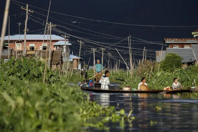 People travel in boats on Inle lake, in Myanmar's Shan State September 4, 2015. (Photo by Soe Zeya Tun/Reuters)
