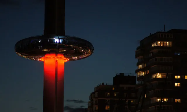 The British Airways i360 vertical cable car carries passengers to the top of the tower on its first day open to the public in Brighton, UK on August 5, 2016. The 90-tonne pod is made of 24 segments of handmade glass, holds up to 200 people and can rise up to 137 metres in front of the city’s West Pier. (Photo by Haydn West/Rex Features/Shutterstock)