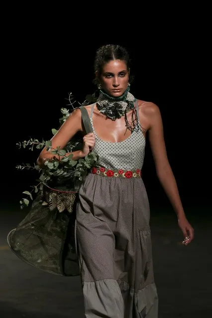 A model displays a creation by Portuguese designer Teresa Martins for TM Collection during his runway show at the 41st edition of the Portugal Fashion Event in Lisbon, Portugal, 14 October 2017. (Photo by Jose Sena Goulao/EPA/EFE)