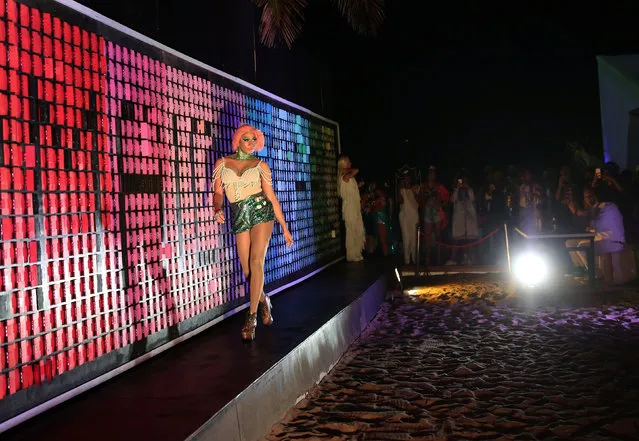 A participant walks the runway during a mermaid competition at Ipanema beach in Rio de Janeiro, Brazil on August 14, 2016. (Photo by Nacho Doce/Reuters)