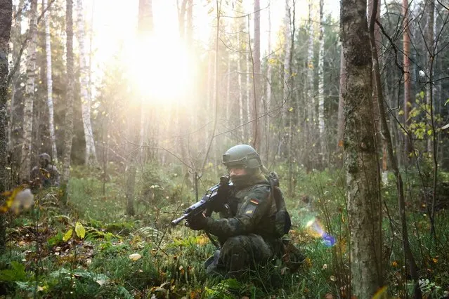 A German soldier of the Air Force Regiment takes part in an exercise in the woods during the Baltic Tiger 2022 binational military exercise, which is a contribution at NATO's eastern flank, near Amari, Estonia on October 24, 2022. (Photo by Lisi Niesner/Reuters)