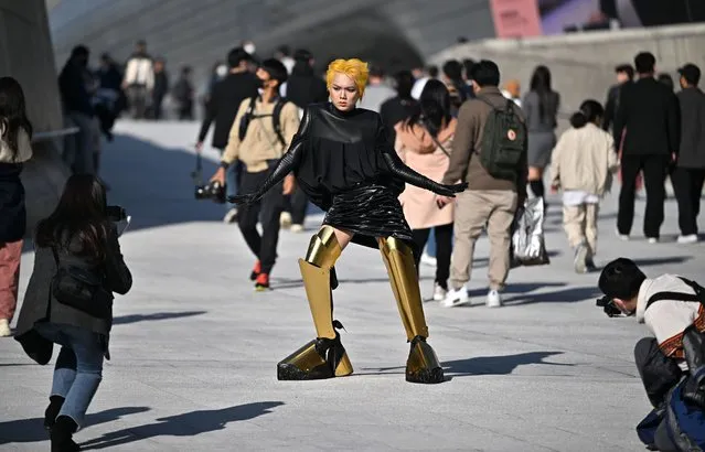 An attendee poses for a photo during the 2022 Spring/Summer Seoul Fashion Week at the Dongdaemun Design Plaza in Seoul on October 11, 2022. (Photo by Jung Yeon-je/AFP Photo)