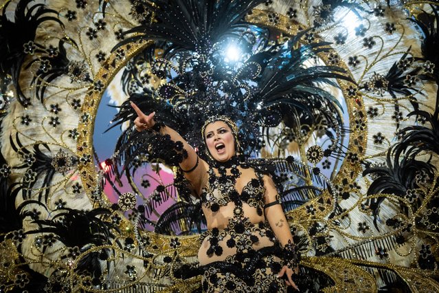 A model, wearing a special costume, is seen during Queen's Election Gala of the Santa Cruz de Tenerife Carnivals in Tenerife, Canary Islands, Spain on February 26, 2025. Costumes can take up to nine months of continuous effort to design and create, weighing over 800 kilograms and costing thousands of euros. (Photo by Andres Gutierrez/Anadolu via Getty Images)