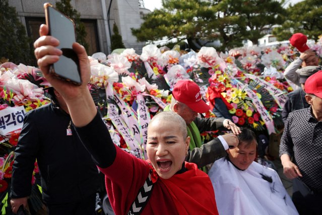 A far-right protester who had her head shaved, chants slogans in protest against the Constitutional Court, in front of the court in Seoul, South Korea, on March 13, 2025. (Photo by Kim Hong-Ji/Reuters)