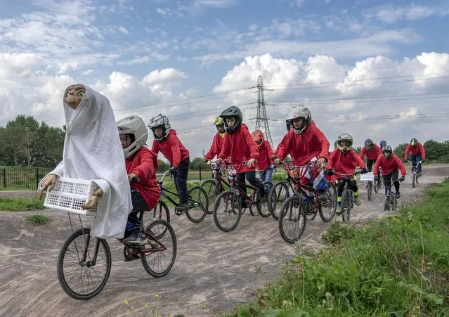 Young BMX riders in Walthamstow, United Kingdom dress as Elliott to celebrate 40 years since ET: The Extra-Terrestrial was released and the launch of the new game ET: The Extra-Terrestrial Light Years From Home on October 21, 2022. (Photo by Jeff Moore/The Times)