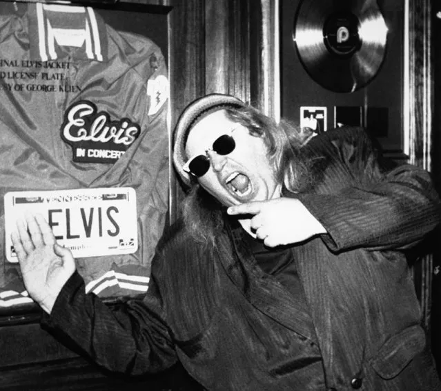 In this June 10, 1988 photo, comedian Sam Kinison, known for his bellowed outbursts, poses at New York's Hard Rock Cafe where he was filming a promo for MTV.  Carl La Bove, a longtime friend of Sam Kinison says recently-obtained DNA testing shows the late comedian fathered a daughter that he has been ordered to pay child support on for years. (Photo by AP Photo)