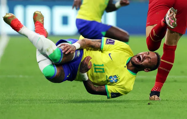 Neymar (10) of Brazil lies on the ground after injury during the FIFA World Cup Qatar 2022 Group G match between Brazil and Serbia at Lusail Stadium in Lusail City, Qatar on November 24, 2022. (Photo by Amanda Perobelli/Reuters)