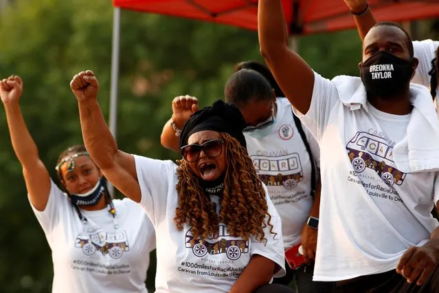 A delegation of people calling for justice for Breonna Taylor arrives from Louisville, Kentucky, and unites with the McClain family to protest police violence in the lead up to the one year anniversary of Elijah McClain's death in Denver, Colorado, U.S., August 22, 2020. (Photo by Kevin Mohatt/Reuters)