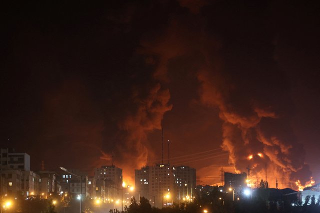 Fire of Israeli attack on Sharan Oil depot is seen following the Israeli strikes on Iran, in Tehran, Iran, on June 15, 2025. (Photo by Majid Asgaripour/WANA (West Asia News Agency) via Reuters)