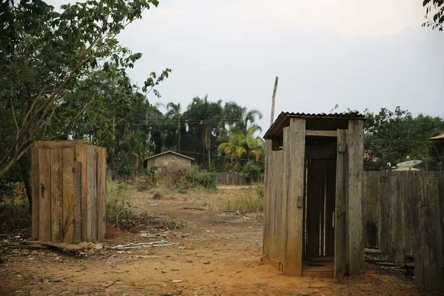 Bathrooms are seen outside a house in Rio Pardo next to Bom Futuro National Forest, in the district of Porto Velho, Rondonia State, Brazil, September 1, 2015. (Photo by Nacho Doce/Reuters)