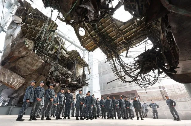 South Korean Navy sailors look at the wreckage of the “Cheonan” warship, which was sunk by North Korea's torpedo attack on 26 March 2010, at the Navy's 2nd Fleet Command in Pyeongtaek, 65 kilometers south of Seoul, 20 March 2023. Forty-six South Korean sailors were killed in the North Korean torpedo attack. (Photo by Yonhap/EPA)