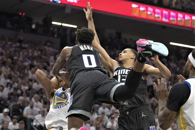 Sacramento Kings guard Malik Monk (0) and forward Keegan Murray (13) defend against Golden State Warriors guard Jordan Poole (3) during the first quarter of Game 1 of a first-round NBA basketball playoff series in Sacramento, Calif., Saturday, April 15, 2023. (Photo by José Luis Villegas/AP Photo)