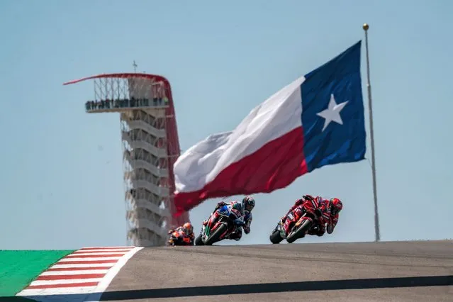 Francesco Bagnaia of Italy and Ducati Lenovo Team leads the race in front of Alex Rins of Spain and LCR Honda Castrol during the Race of the MotoGP Red Bull Grand Prix of The Americas at Circuit of The Americason April 16, 2023 in Austin, Texas. (Photo by Steve Wobser/Getty Images)