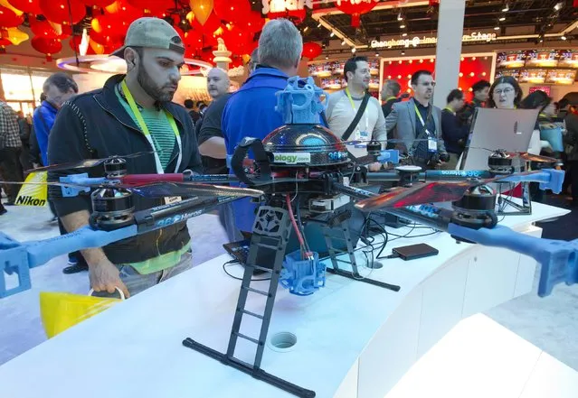 A man looks over a 360Heros drone at the Intel booth during the 2015 International Consumer Electronics Show (CES) in Las Vegas, Nevada January 6, 2015. (Photo by Steve Marcus/Reuters)