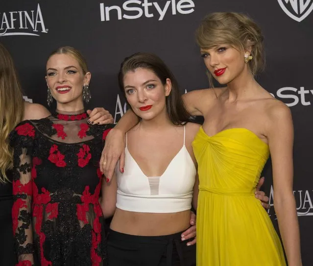 Actress Jaime King (L), recording artists Lorde (C) and Taylor Swift pose at the 16th annual InStyle and Warner Bros. party after the 72nd annual Golden Globe Awards in Beverly Hills, California January 11, 2015. (Photo by Mario Anzuoni/Reuters)