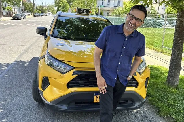 New York City cab driver Sukhcharn Singh poses for a photo with his taxi in the Queens borough of New York, Wednesday, May 17, 2023. Prince Harry and his wife, Meghan, were pursued in their car by photographers after a charity event in New York, Tuesday evening May 16, 2023. With the help of police, the couple was eventually able to switch to Singh's taxi cab and be whisked away, according to a law enforcement official who was not authorized to speak publicly about the matter and did so on condition of anonymity. (Photo by David R. Martin/AP Photo)