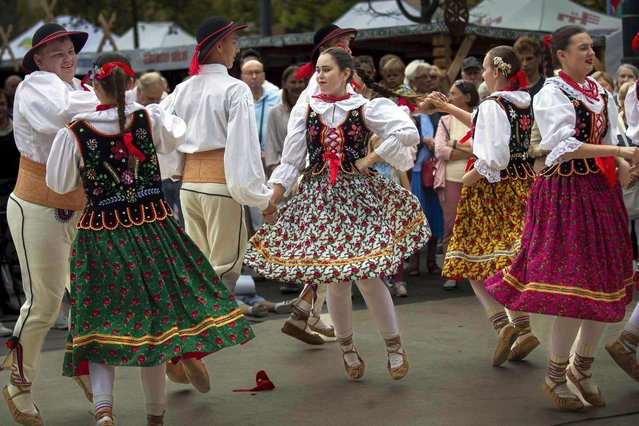 The Polish dance group dances during the traditional Nations' Fair at the Kudirkos Square in Vilnius, Lithuania, Sunday, September 15, 2024. (Photo by Mindaugas Kulbis/AP Photo)