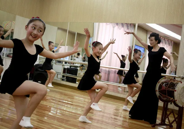 Girls dance in a studio at the Mangyongdae Children's Palace in Pyongyang, North Korea, Thursday, July 26, 2018. (Photo by Dita Alangkara/AP Photo)