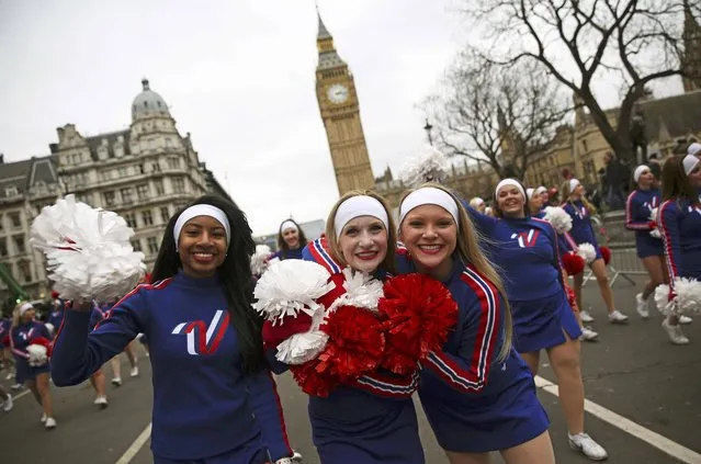 Members of the Varsity All-American Cheerleaders and Dancers react after performing at the New Year's Day Parade in London, Britain January 1, 2016. (Photo by Neil Hall/Reuters)
