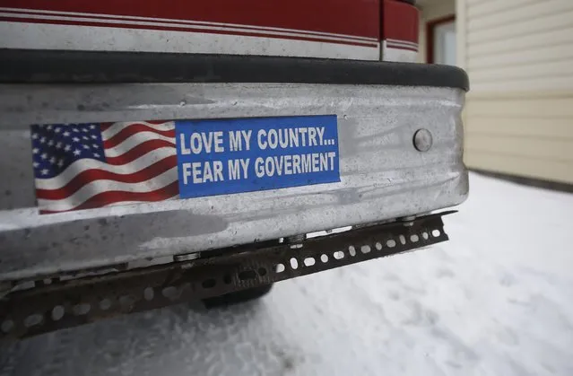 A bumper sticker on a private truck is seen in front of a residential building at the Malheur National Wildlife Refuge near Burns, Oregon, January 5, 2016. Saturday's takeover of the Malheur National Wildlife Refuge outside the town of Burns, Oregon, marked the latest protest over federal management of public land in the West, long seen by conservatives in the region as an intrusion on individual rights. (Photo by Jim Urquhart/Reuters)