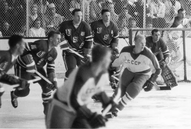 American professional hockey player John Mayasich (third from left), defenseman for Team USA, on the ice during the final round of men's ice hockey with the Soviet Team at the 1960 Winter Olympics in Blyth Arena at the Squaw Valley Ski Resort, Olympic Valley, California, February 27, 1960. American professional hockey player Jack McCartan (right), goalie for Team USA, guards the goal post. The American team scored a 3-2 victory over the Soviet Team and eventually won the gold medal. (Photo by Bruce Bennett Studios/Getty Images) 