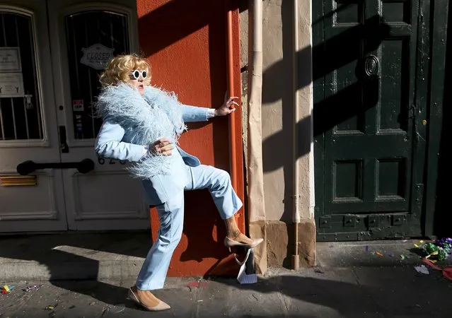 A reveler makes his way through the French Quarter on Mardi Gras in New Orleans, Louisiana February 17, 2015. (Photo by Jonathan Bachman/Reuters)