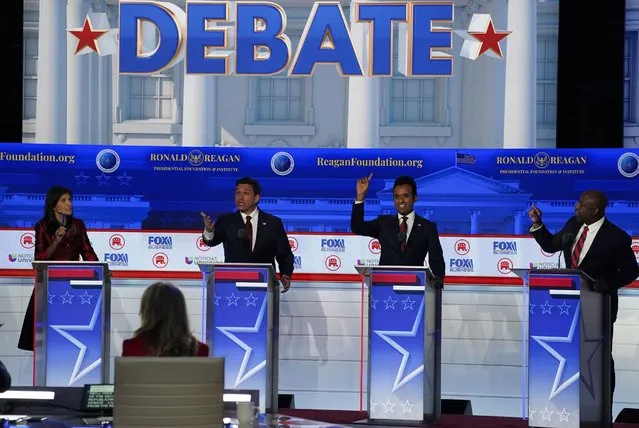 Former South Carolina governor Nikki Haley, left, and Sen. Tim Scott (R-SC), far right, argue during the second Republican presidential primary debate hosted by Fox News at Ronald Reagan Presidential Library in Simi Valley, Calif., Wednesday, September 27, 2023. Republican presidential contenders, minus former president Donald Trump, will face off tonight in their second debate of the primary season. (Photo by Melina Mara/The Washington Post)