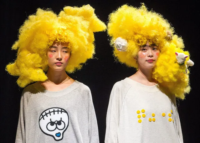 Models present a creation by Japanese designer Takafumi Tsuruta for his label Tenbo during the Mercedes-Benz Fashion Week in Tokyo, Japan, 18 March 2015. (Photo by Christopher Jue/EPA)