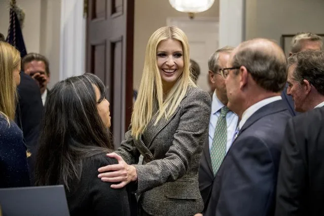 In this November 14, 2018, photo, Ivanka Trump, the daughter of President Donald Trump, center, greets guests after President Donald Trump spoke about prison reform in the Roosevelt Room of the White House in Washington. Ivanka Trump, the president’s daughter and adviser, sent hundreds of emails about government business from a personal email account last year. That’s according to the Washington Post, which reports the emails were sent to other White House aides, Cabinet officials and her assistants. (Photo by Andrew Harnik/AP Photo)