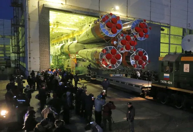 Russia's Soyuz-FG booster rocket with the space capsule Soyuz TMA-16M that will carry a new crew to the International Space Station (ISS) is transported from the hangar to the launch pad in Russian leased Baikonur cosmodrome, Kazakhstan, Wednesday, March 25, 2015. The new Soyuz mission is scheduled for Saturday, March 28. (Photo by Dmitry Lovetsky/AP Photo)