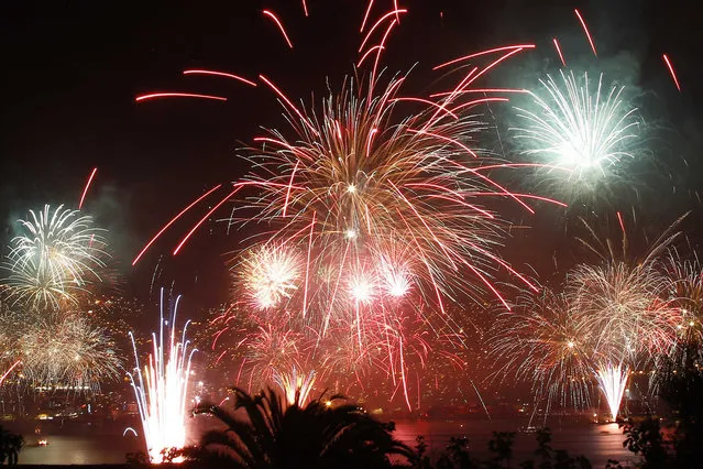 Fireworks explode during a pyrotechnics show to celebrate the New Year in the coastal city of Valparaiso, about 121 km (75 miles) northwest of Santiago, January 1, 2014. (Photo by Eliseo Fernandez/Reuters)