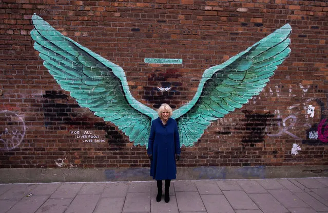 Britain's Camilla, the Duchess of Cornwall poses in front of a mural entitled “For All Liverpool's Liver Birds” during a visit in Liverpool, Britain, 12 February 2019. (Photo by Peter Powell/EPA/EFE)