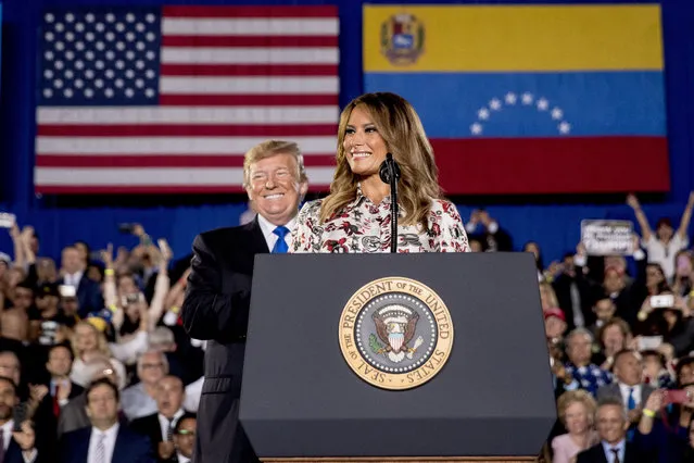 First lady Melania Trump, accompanied by President Donald Trump, smiles as she speaks in front of a Venezuelan American community at Florida Ocean Bank Convocation Center at Florida International University in Miami, Fla., Monday, February 18, 2019, as Trump speaks out against President Nicolas Maduro's government and its socialist policies. (Photo by Andrew Harnik/AP Photo)